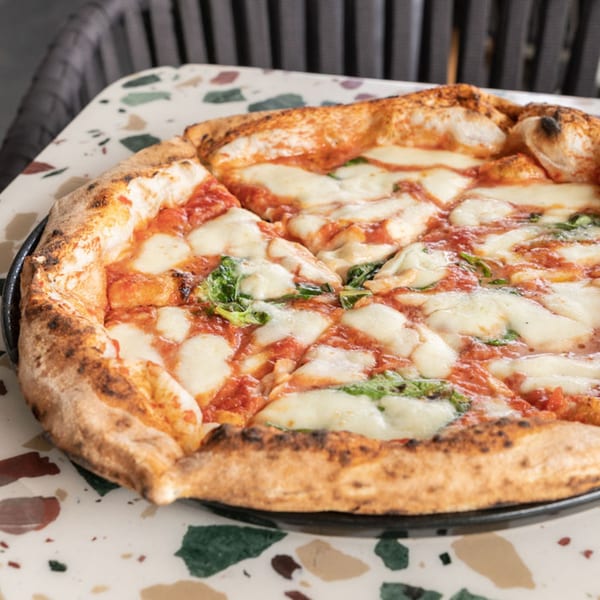 Nardò Italian Restaurant's Margherita pizza with melted mozzarella, tomato sauce, and fresh basil.